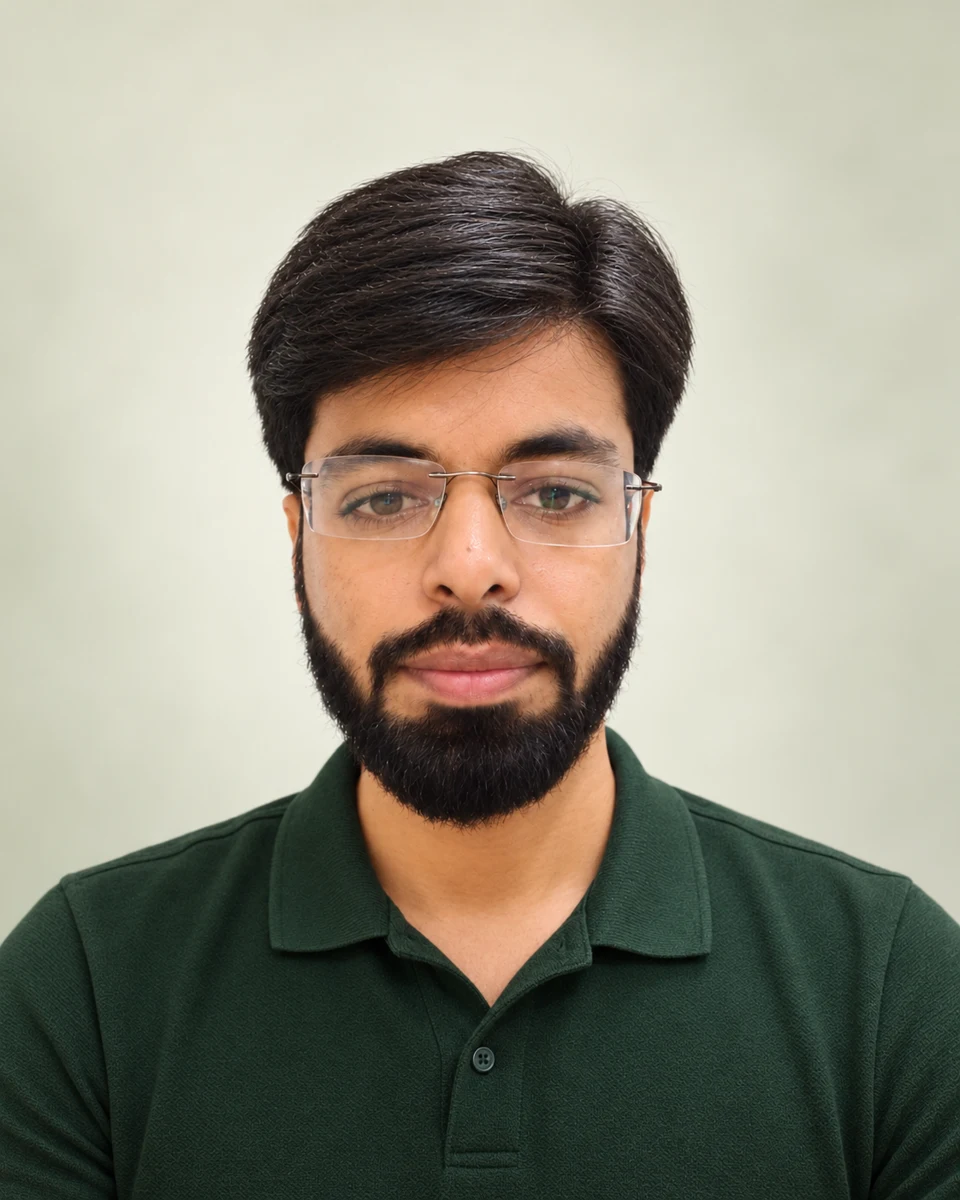 Sanjay Ahuja, founder of Web With Sanjay, wearing a dark green polo shirt.